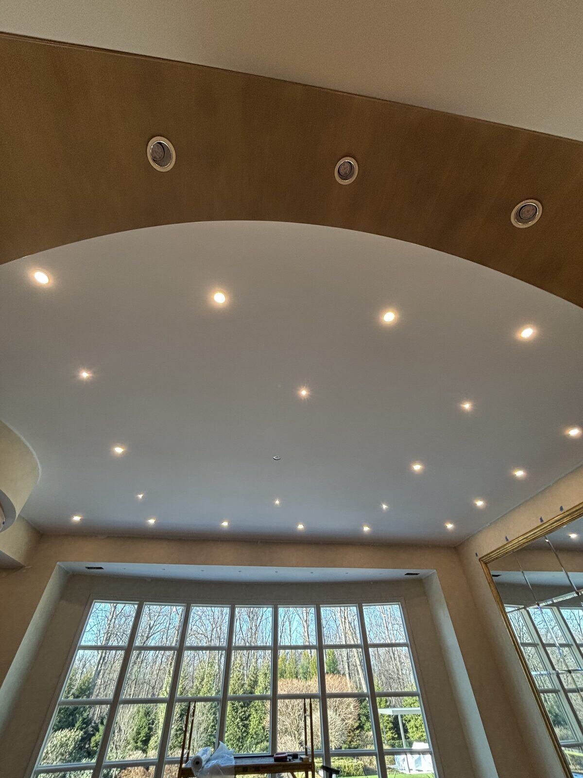Recessed lighting installed across a domed ceiling in a New Jersey home by Pride Energy